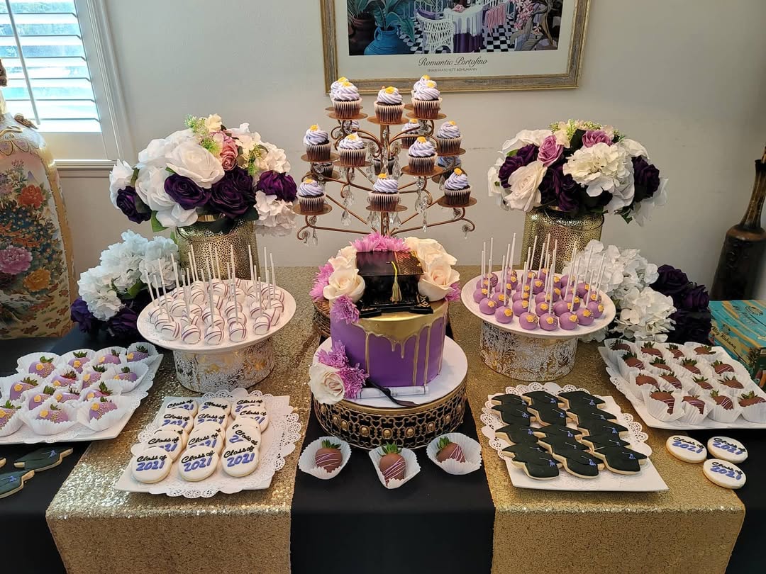Celebrate with stunning dessert table ideas featuring a purple and gold graduation cake, cupcakes, cake pops, decorated cookies, and elegant flower arrangements—perfect for showcasing your favorite party desserts.