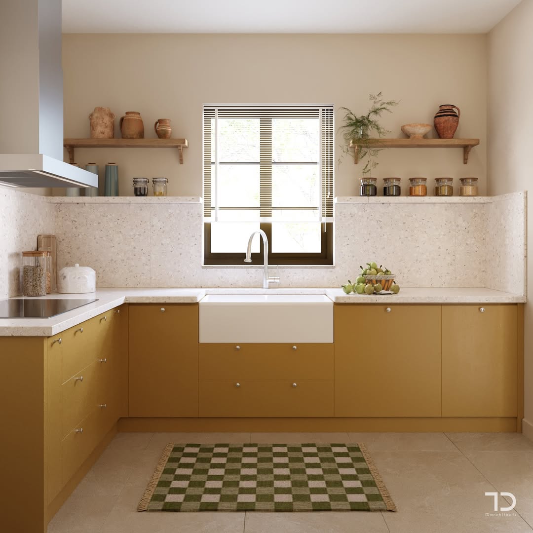 Modern kitchen with mustard yellow cabinets, a farmhouse sink under a window, open shelves with pottery, and a green checkered rug—showcasing stunning kitchen colors and fresh kitchen trends 2025.